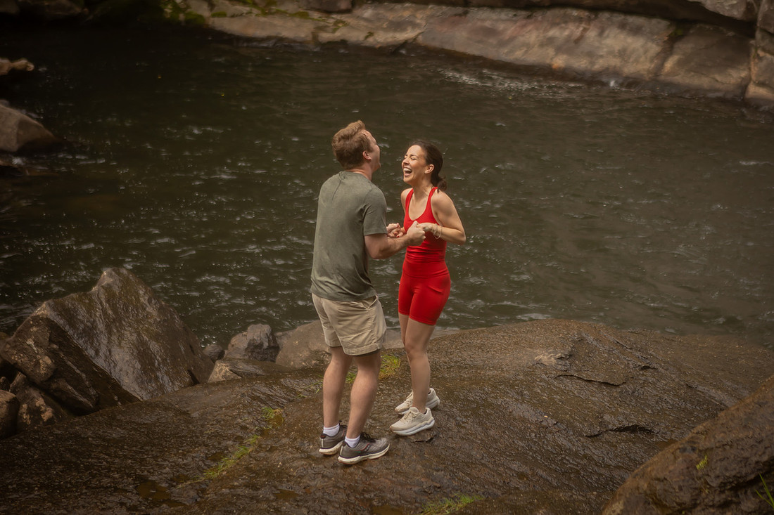 Hiking Proposal in front of Rainbow Falls in Gorges State Park | WNC Engagement Photographer