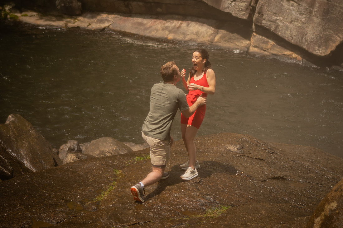 Hiking Proposal in front of Rainbow Falls in Gorges State Park | WNC Engagement Photographer