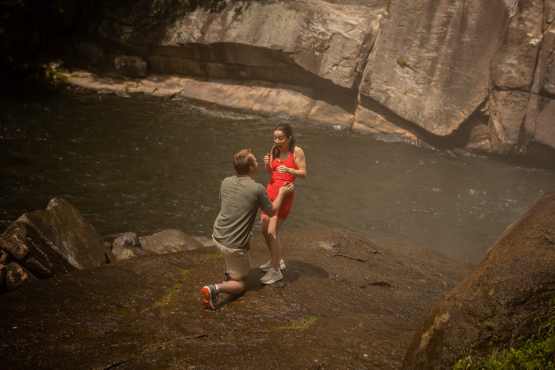 Hiking Proposal in front of Rainbow Falls in Gorges State Park | WNC Engagement Photographer