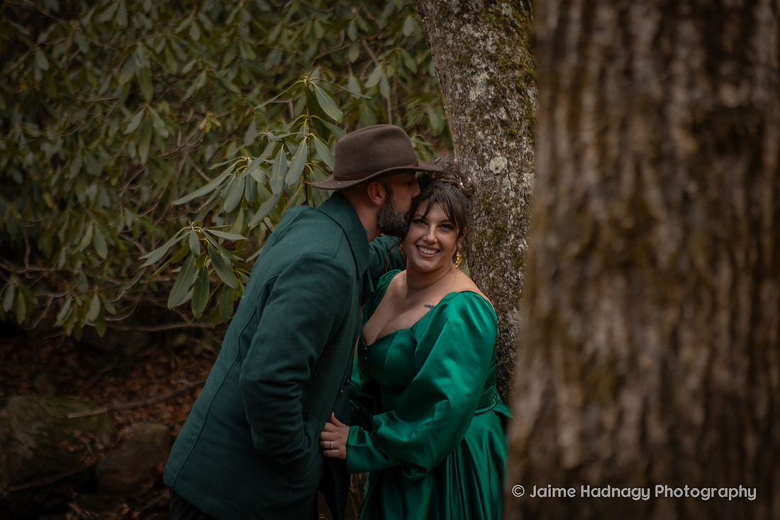 Couples Photos with Green Outfits in the Forest in Wintertime | Black Mountain Portrait Photogapher