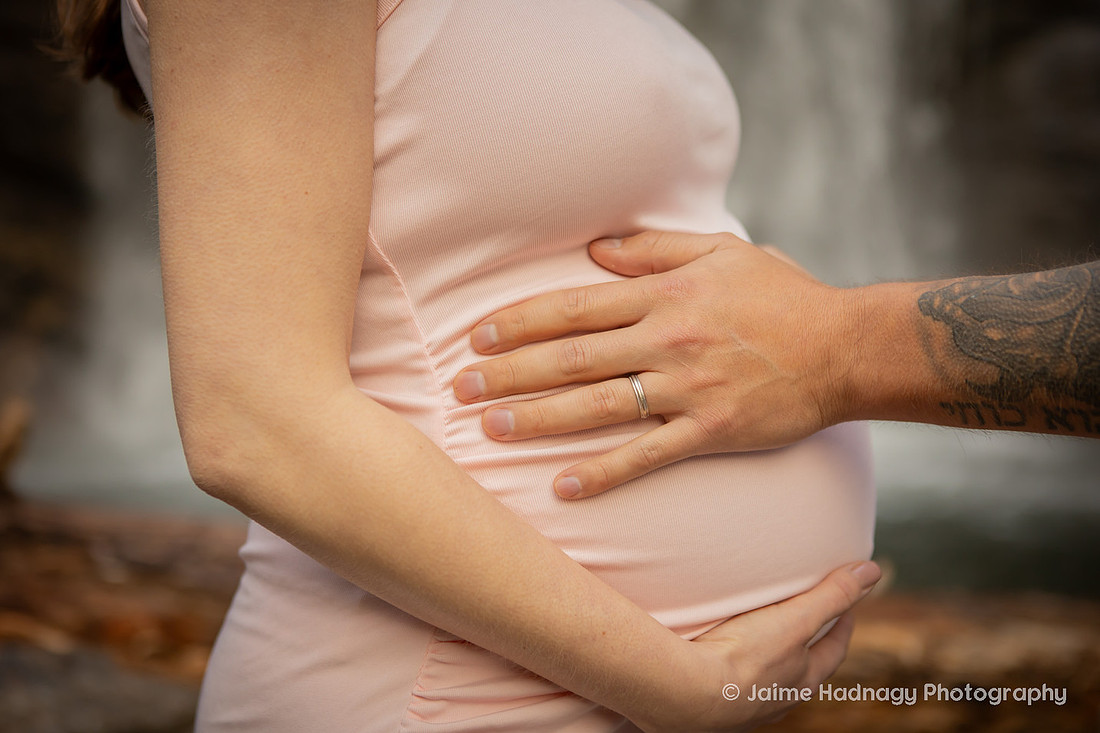 Nature Loving Couples Pregnancy Photos at Looking Glass Falls | Asheville Family Photographer