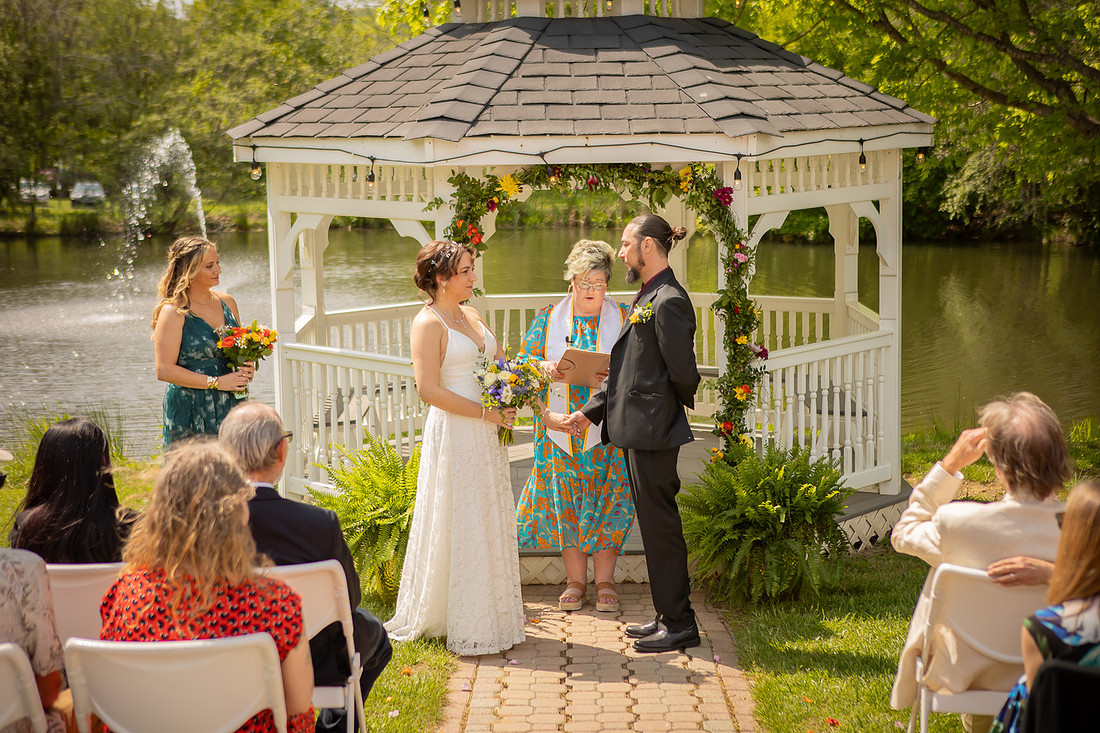 Wedding Photography in front of a White Gazebo and Pond 