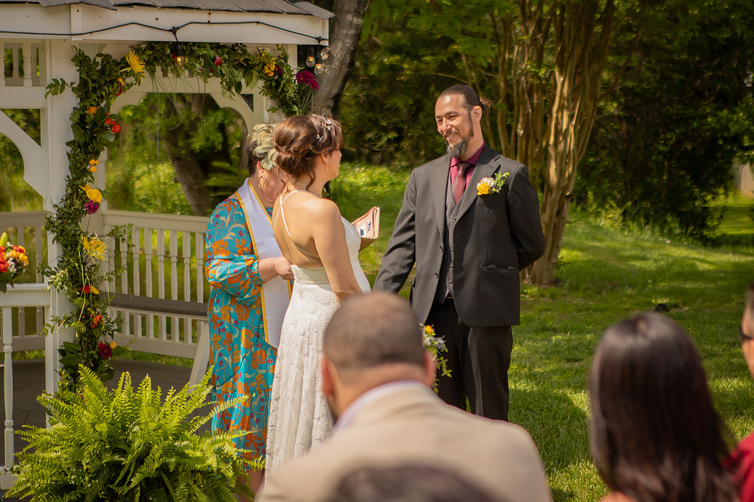 Wedding Photography in front of a White Gazebo and Pond 