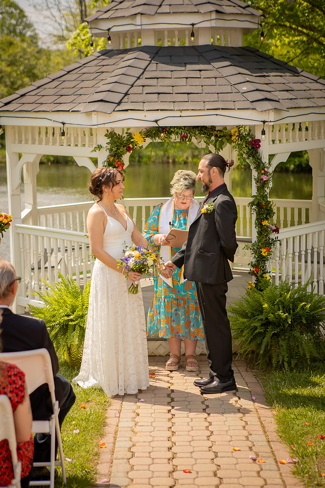 Wedding Photography in front of a White Gazebo and Pond 
