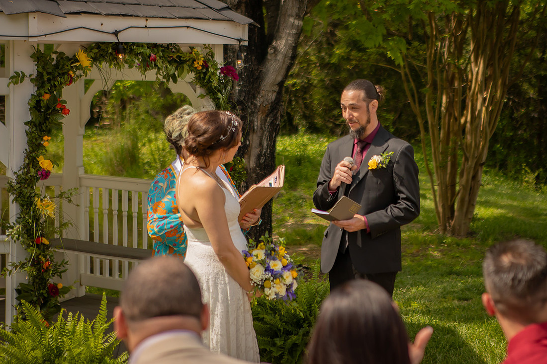 Wedding Photography in front of a White Gazebo and Pond 