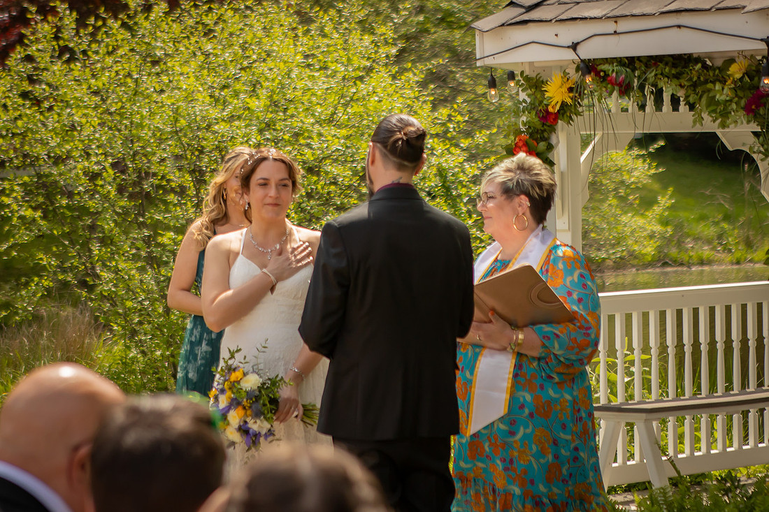 Wedding Photography in front of a White Gazebo and Pond 