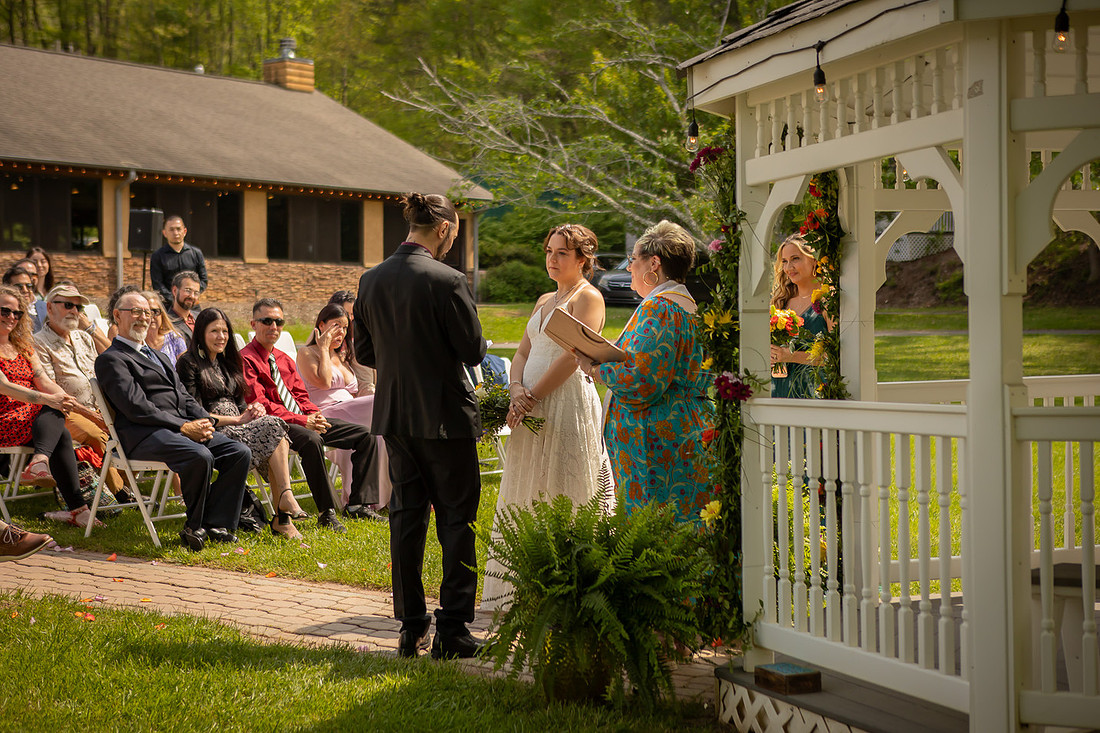 Wedding Photography in front of a White Gazebo and Pond 