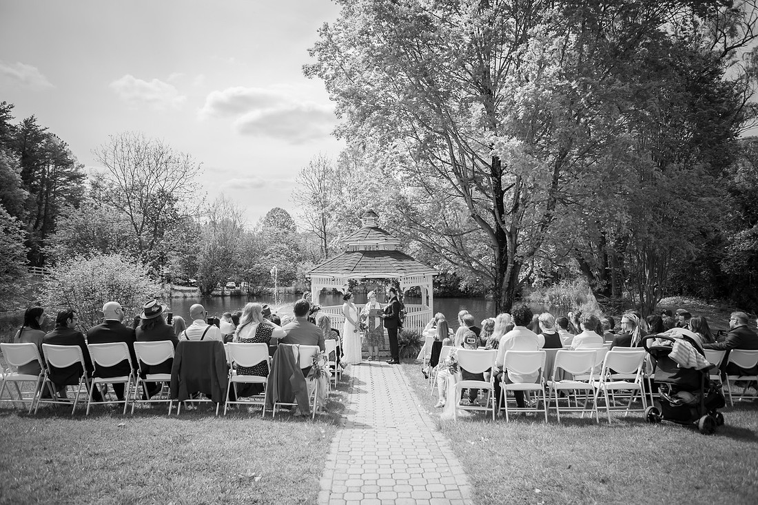Wedding Photography in front of a White Gazebo and Pond 
