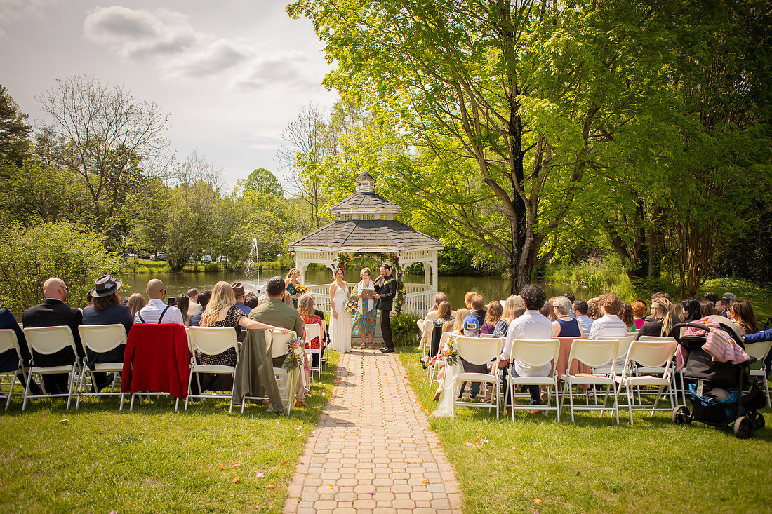 Wedding Photography in front of a White Gazebo and Pond 