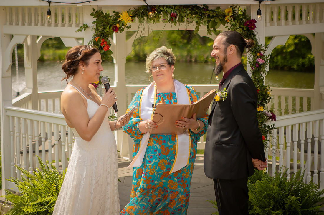 Wedding Photography in front of a White Gazebo and Pond 