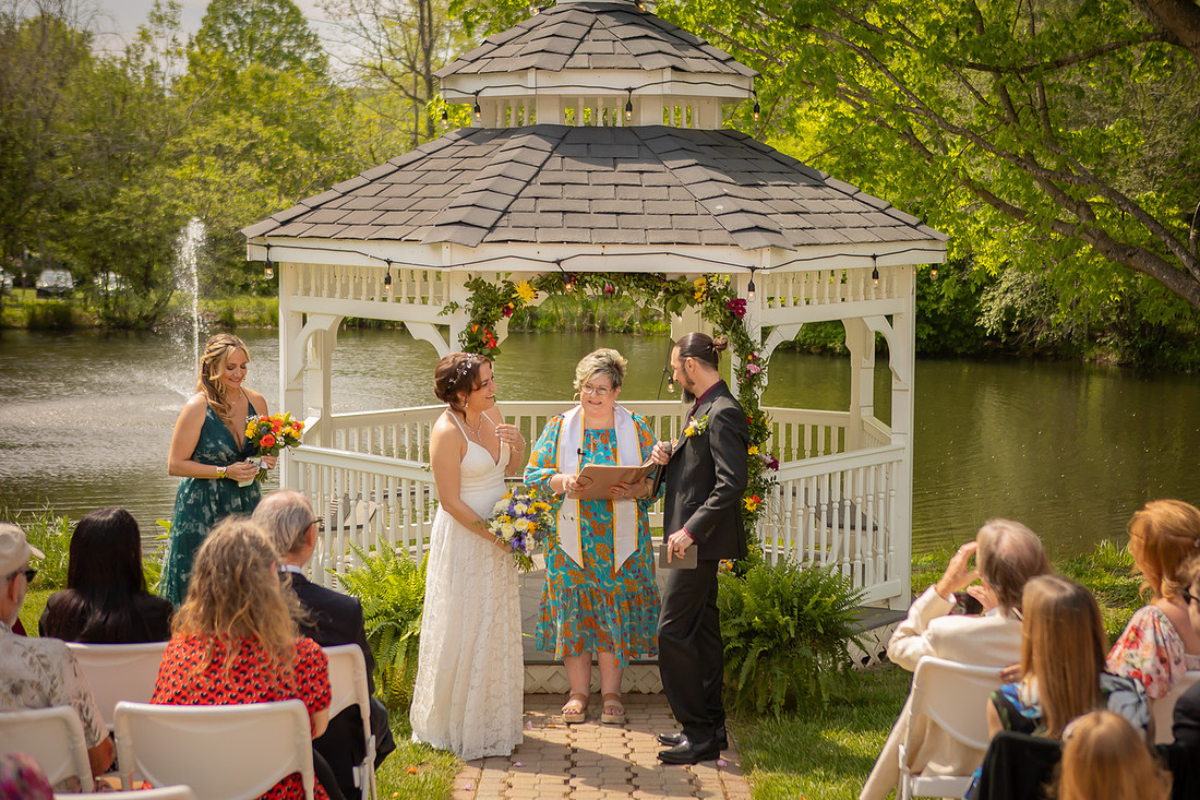 Wedding Photography in front of a White Gazebo and Pond 