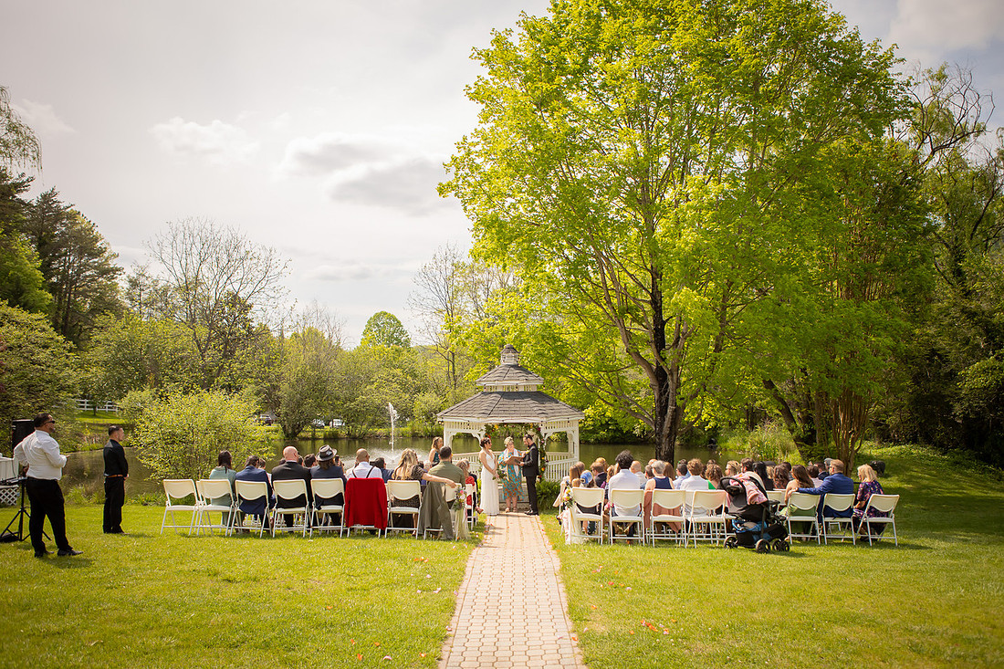 Wedding Photography in front of a White Gazebo and Pond 