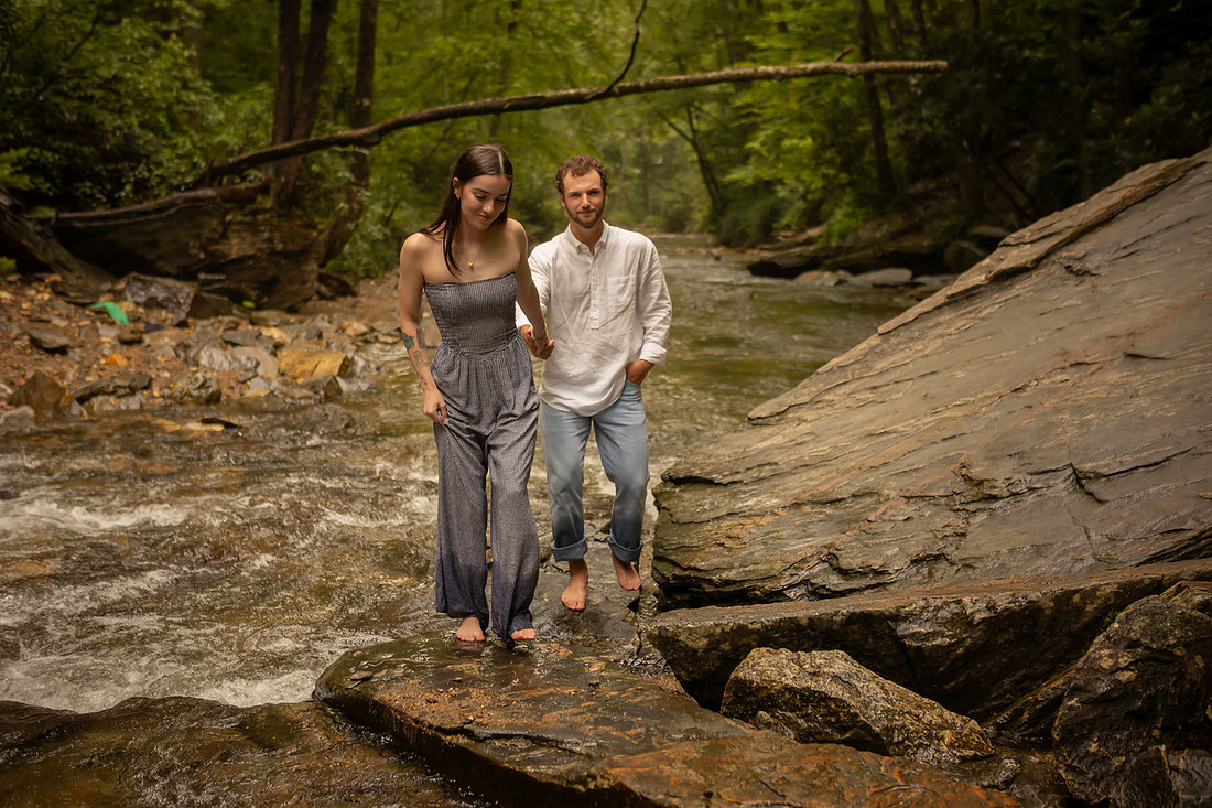 Couple walking out of a river