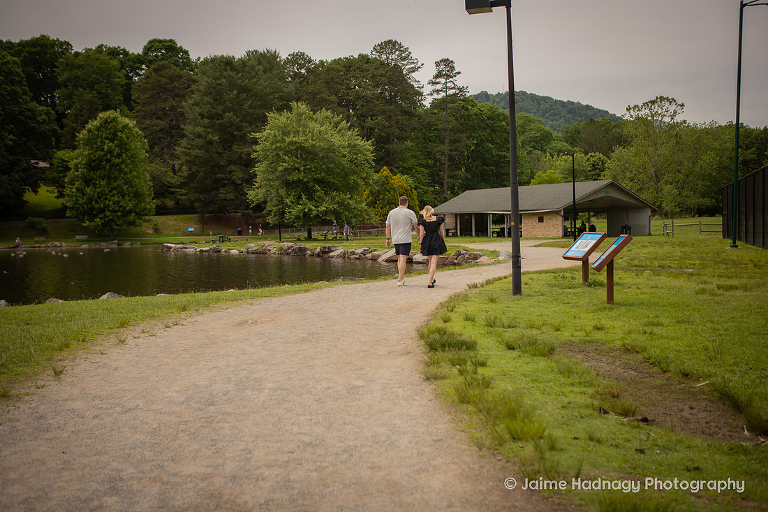 Couple Walking at Lake Tomahawk in Black Mountain NC 