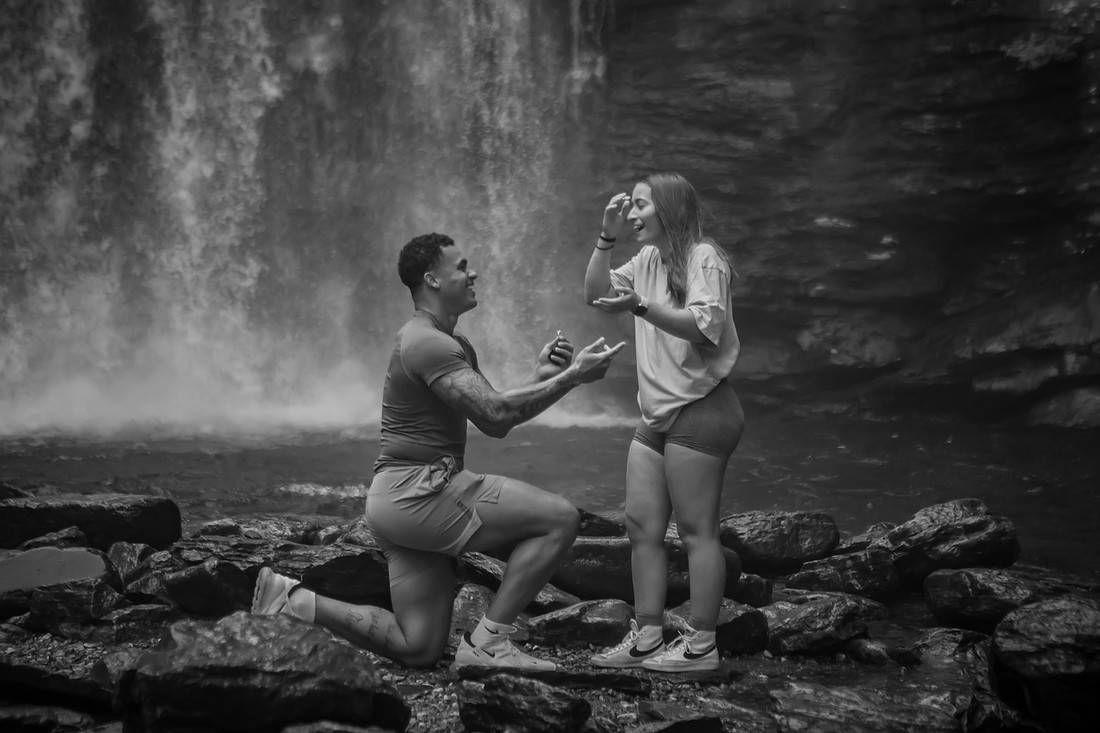 Proposing to his girlfriend at Looking Glass Falls | Asheville Proposal Photographer