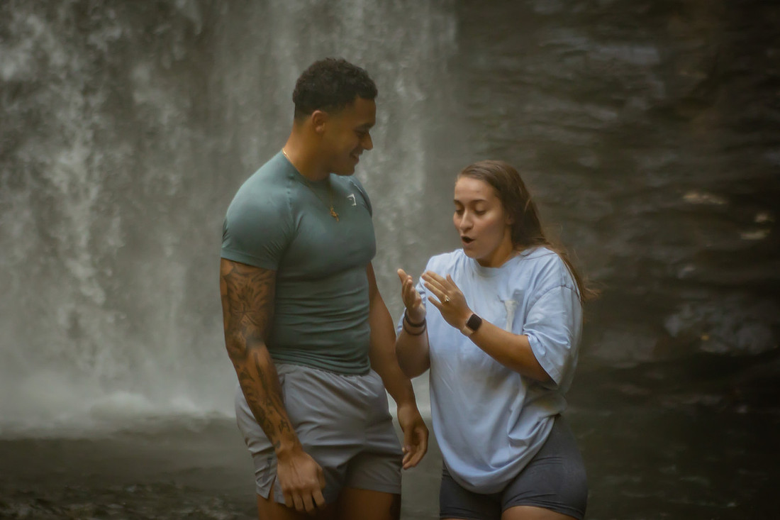 Proposing to his girlfriend at Looking Glass Falls | Asheville Proposal Photographer