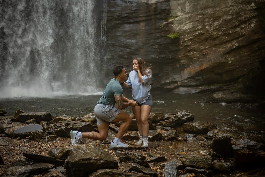 Proposing to his girlfriend at Looking Glass Falls | Asheville Proposal Photographer