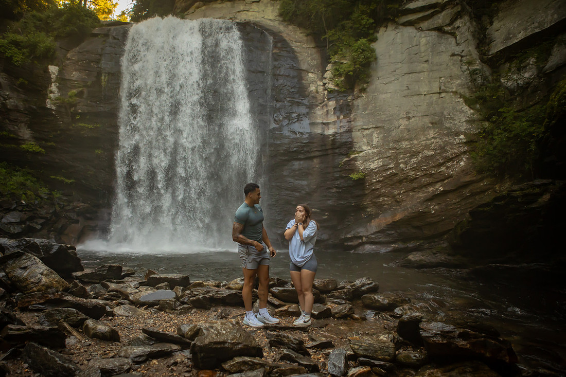 Proposing to his girlfriend at Looking Glass Falls | Asheville Proposal Photographer