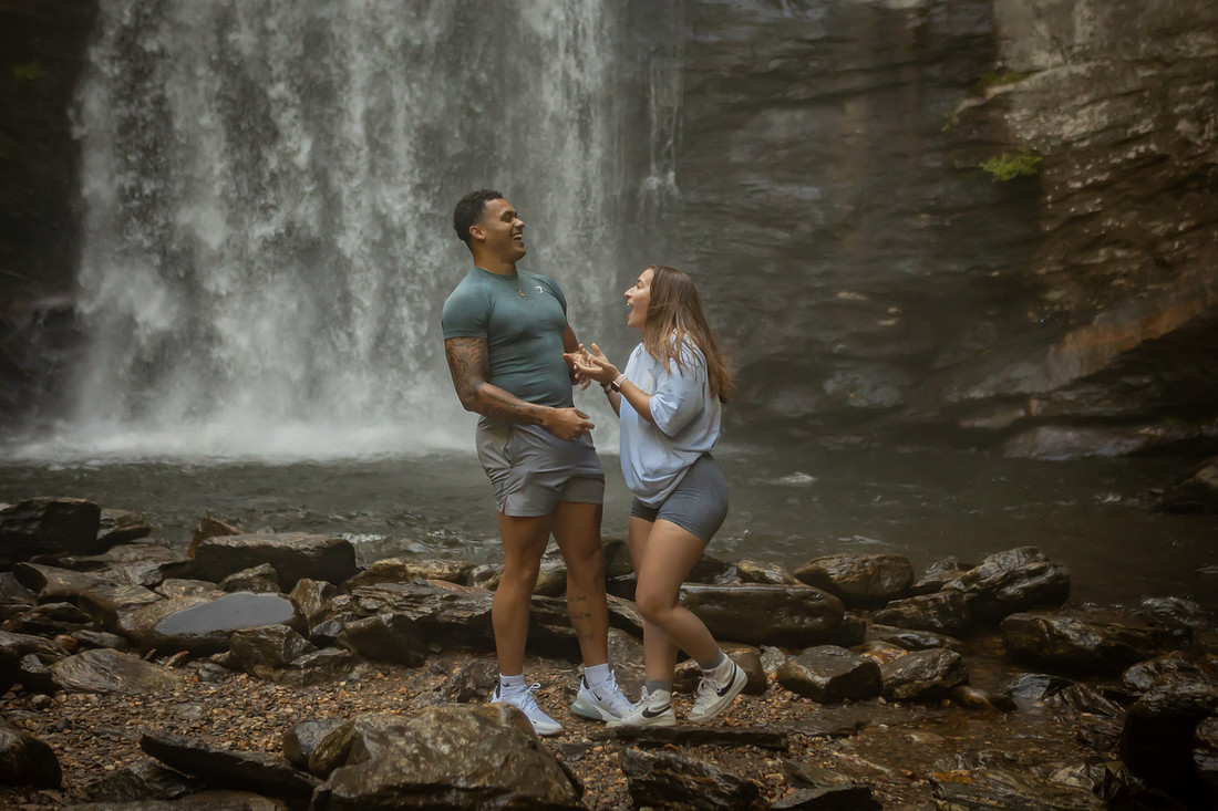 Proposing to his girlfriend at Looking Glass Falls | Asheville Proposal Photographer