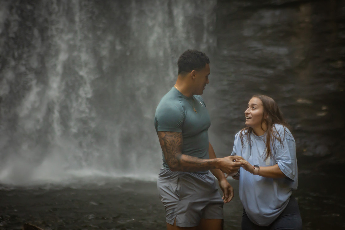 Proposing to his girlfriend at Looking Glass Falls | Asheville Proposal Photographer