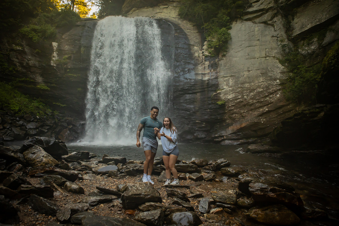 Proposing to his girlfriend at Looking Glass Falls | Asheville Proposal Photographer
