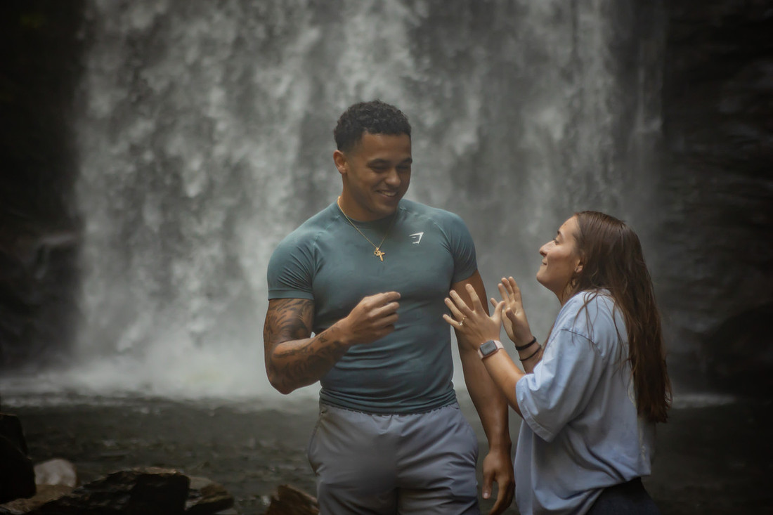 Proposing to his girlfriend at Looking Glass Falls | Asheville Proposal Photographer
