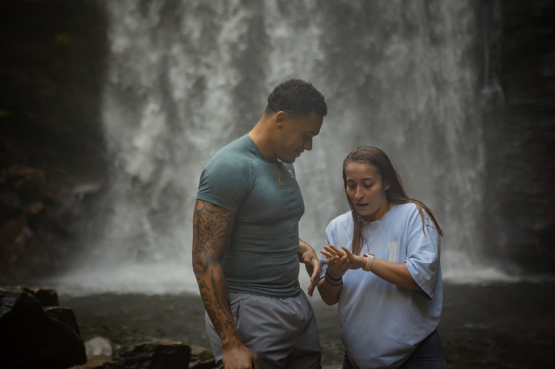 Proposing to his girlfriend at Looking Glass Falls | Asheville Proposal Photographer