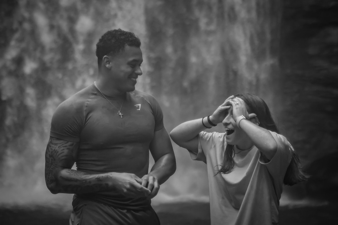 Proposing to his girlfriend at Looking Glass Falls | Asheville Proposal Photographer