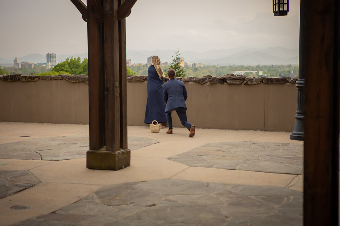 Proposal at Omni Grove Park Inn Vanderbilt Terrace with view of Asheville Downtown | Engagement Photography