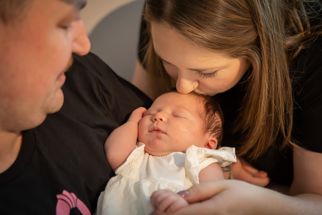 In home Newborn Photoshoot with props like a tiny bed and basket | Asheville Baby Photographer