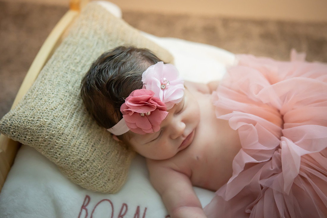 In home Newborn Photoshoot with props like a tiny bed and basket | Asheville Baby Photographer