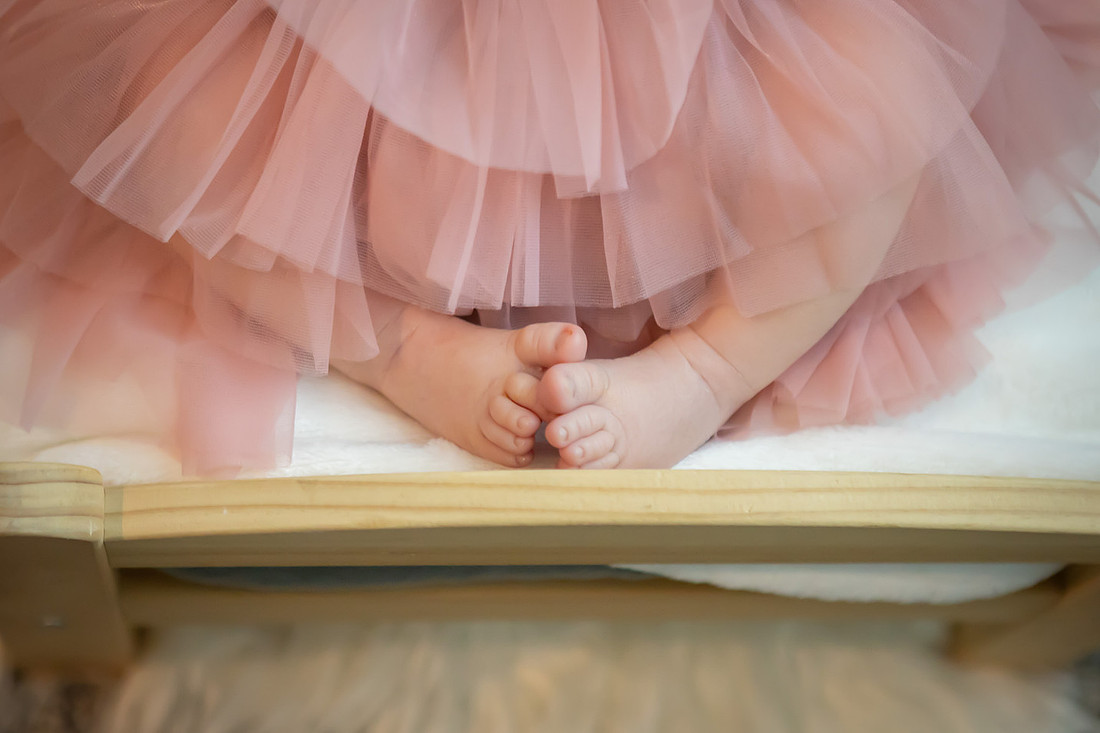 In home Newborn Photoshoot with props like a tiny bed and basket | Asheville Baby Photographer