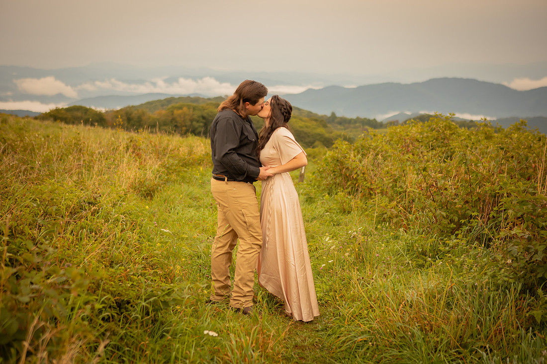 Engagement Photos in the Mountains of Western NC Couple Kissing