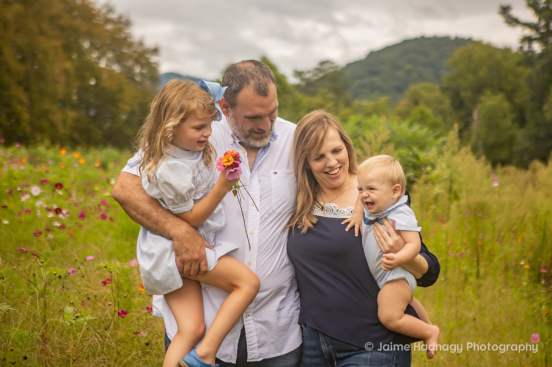 Family Photos in a Flower Field with Mountains | Asheville Photographer