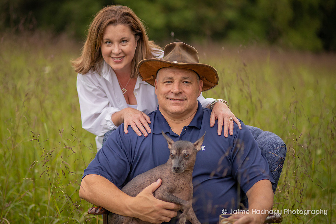 Asheville Family Photographer Portraits with dog in a chair outdoors