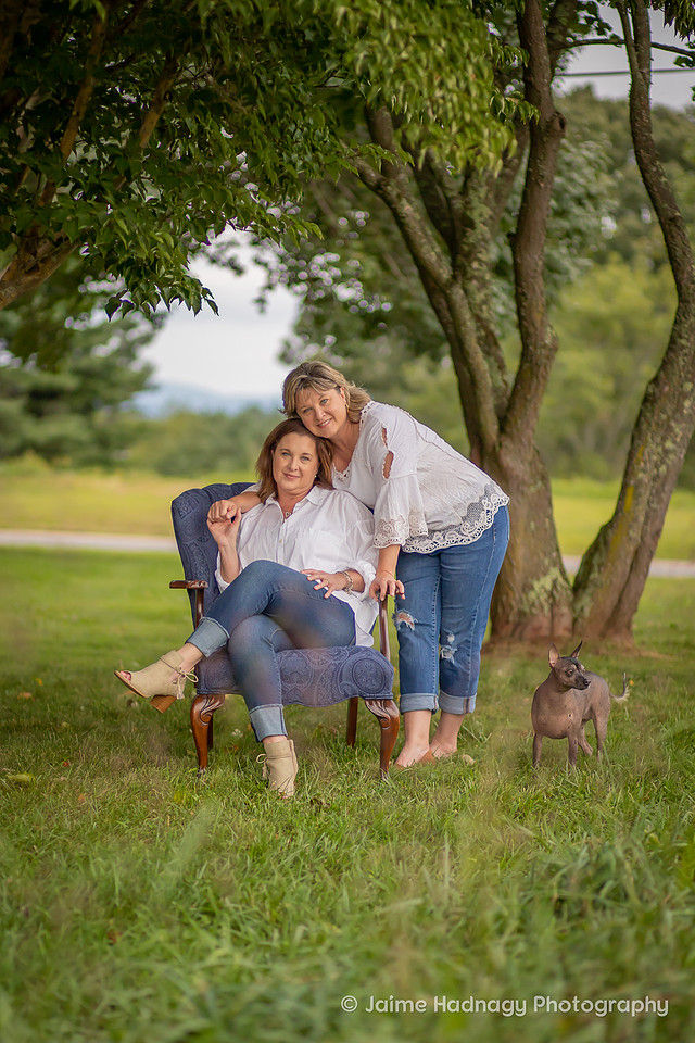 Asheville Family Photographer Portraits with dog in a chair outdoors