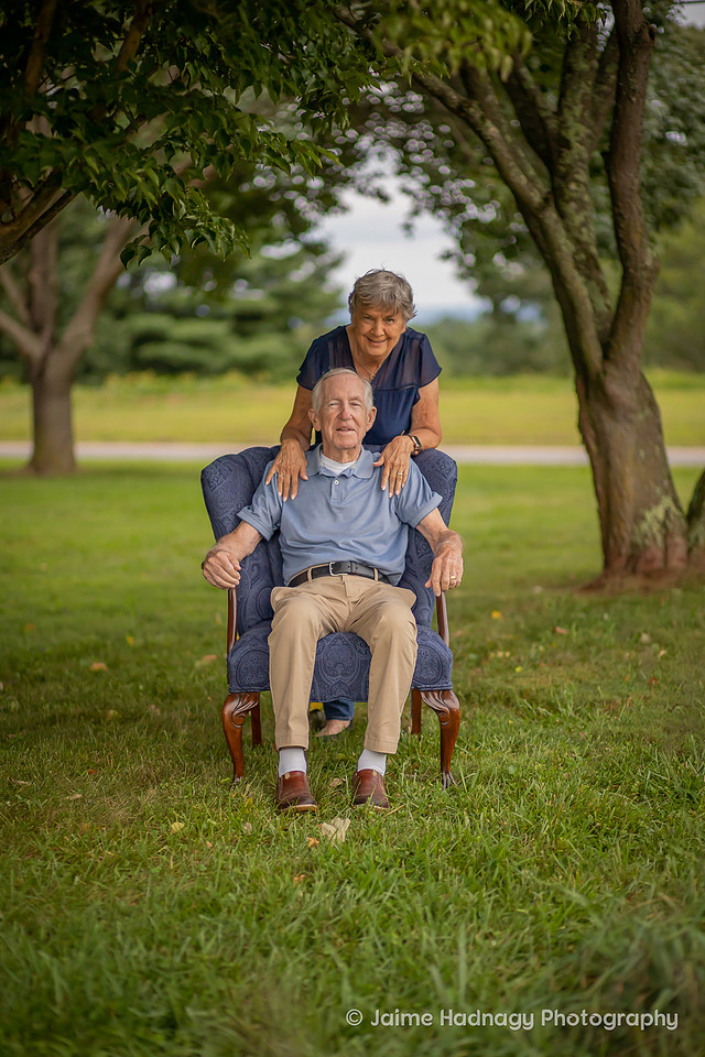 Asheville Family Photographer Portraits with dog in a chair outdoors