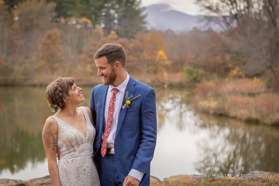 Fun Wedding Portraits of Bride and Groom Outdoors by a Lake | Asheville Photographer