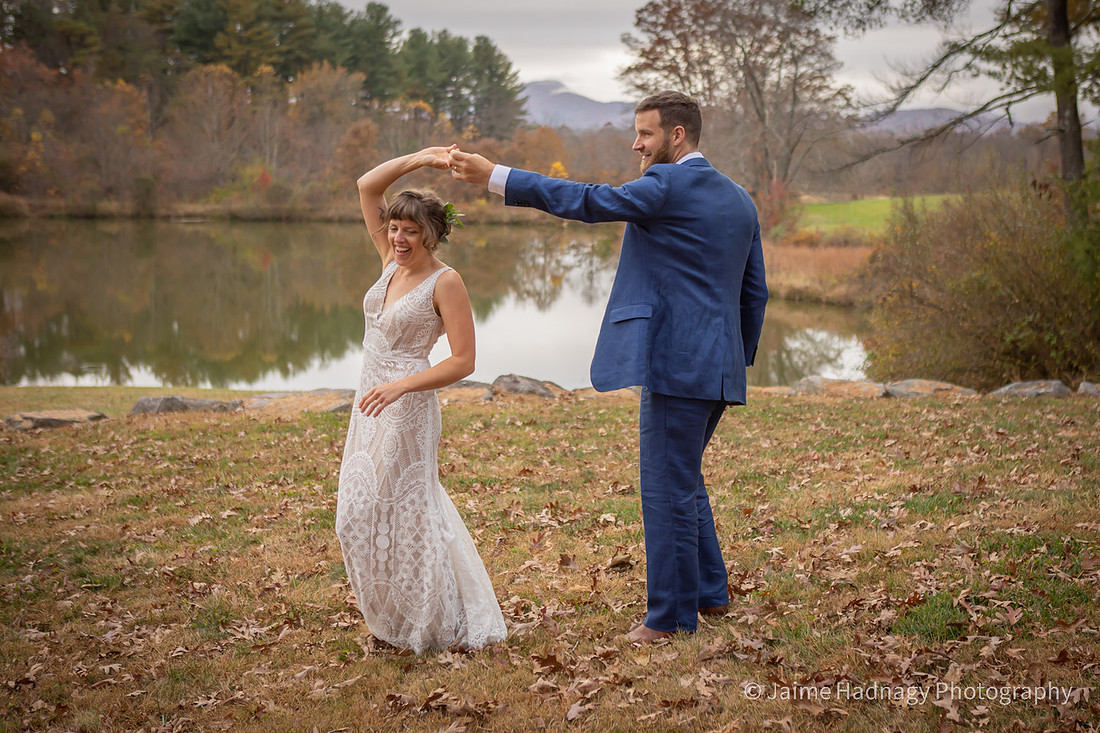 Fun Wedding Portraits of Bride and Groom Outdoors by a Lake | Asheville Photographer