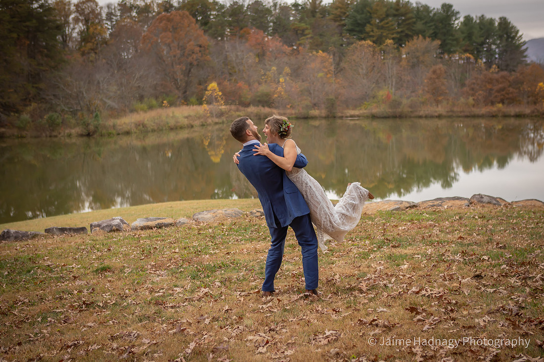 Fun Wedding Portraits of Bride and Groom Outdoors by a Lake | Asheville Photographer