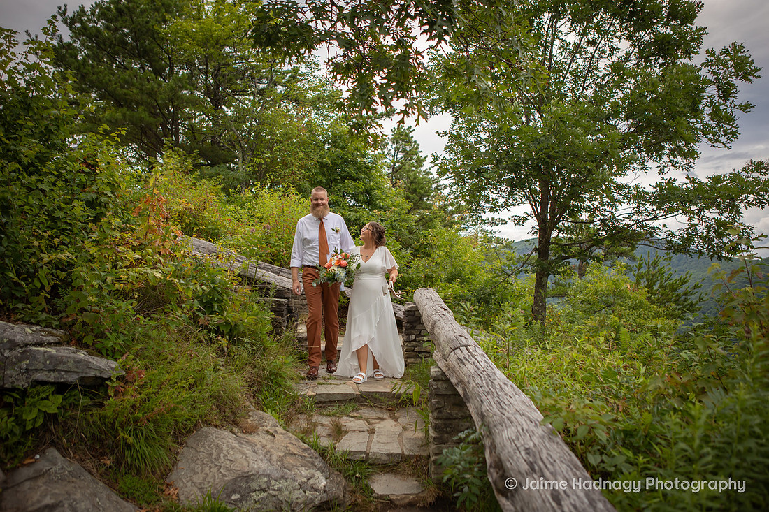 Bride and Groom walking down the stairs at Wiseman's View