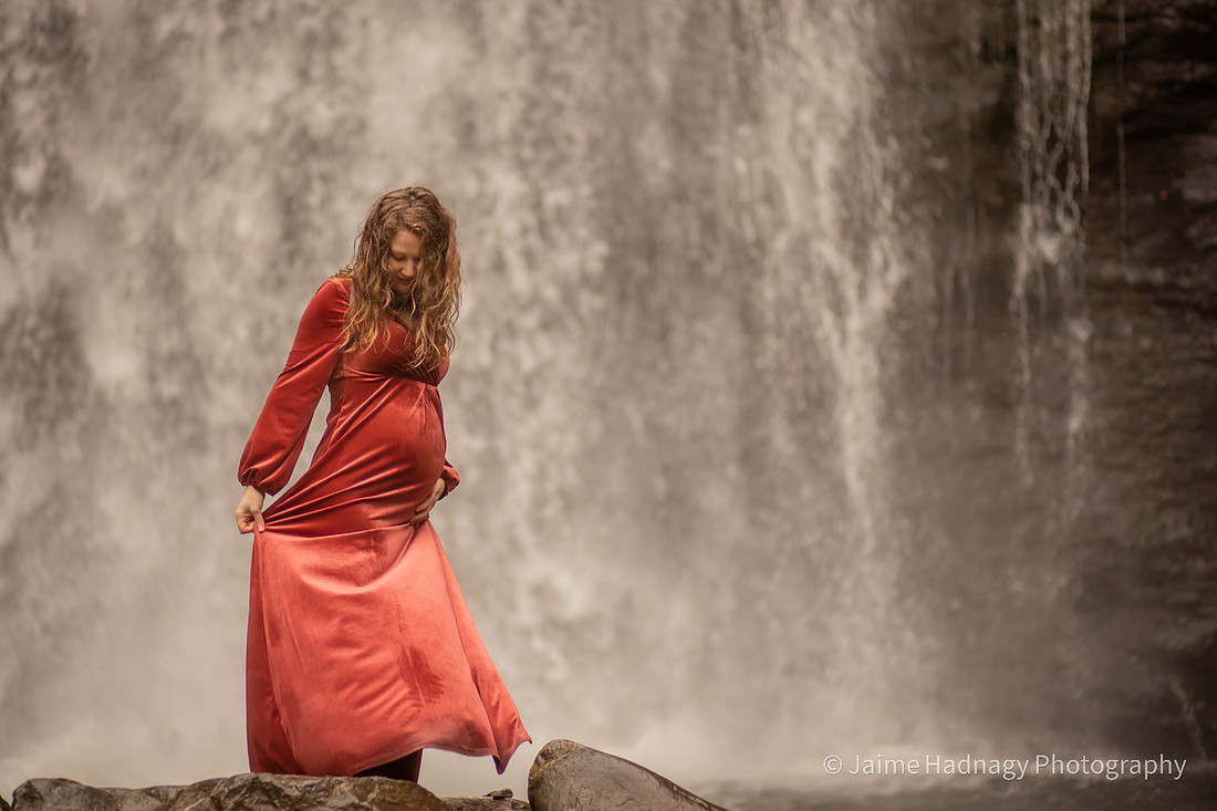 Gorgeous Pregnant Woman at a Waterfall with Umbrella and Red Velvet Dress | North Carolina Photographer