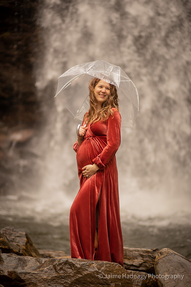 Gorgeous Pregnant Woman at a Waterfall with Umbrella and Red Velvet Dress | North Carolina Photographer