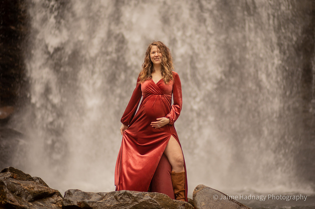 Gorgeous Pregnant Woman at a Waterfall with Umbrella and Red Velvet Dress | North Carolina Photographer