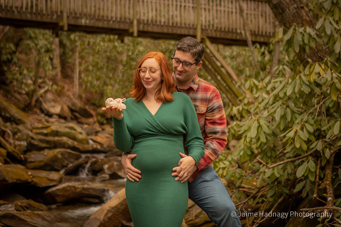 Couples Maternity Photos with tiny Booties by the river | Asheville Family Photographer