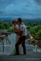 dramatic photo of a couple kissing at dusk at the grove park inn with mountains in the background