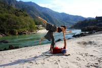 Happy and Rose Acro Yoga Next to the Ganga River
