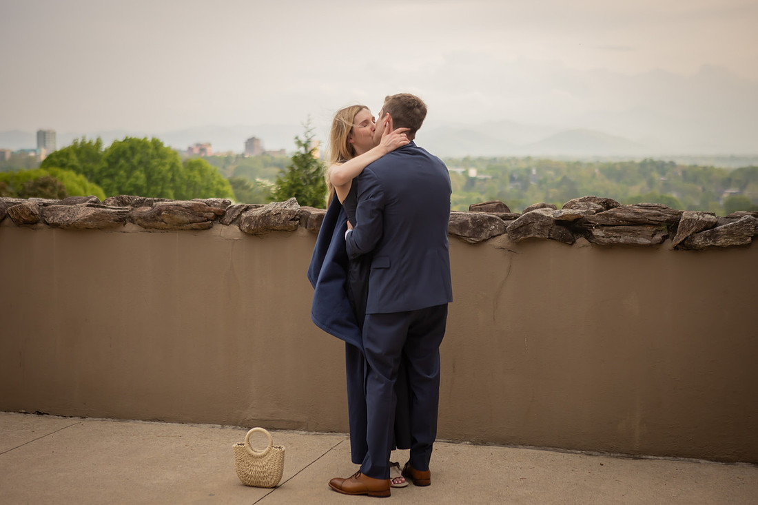 Proposal at Omni Grove Park Inn Vanderbilt Terrace with view of Asheville Downtown | Engagement Photography