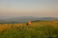 couple looking back from a distance in the mountains at max patch