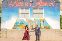 couple dancing in front of the love is in the air mural on the spicer greene jewelers building in downtown asheville